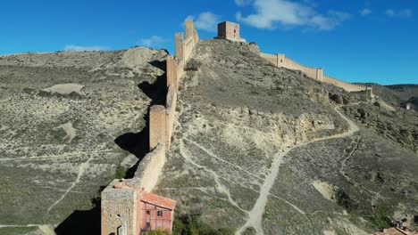 Albarracin-Fortress-and-City-Walls-in-Teruel,-Aragon,-Spain---Aerial-4k