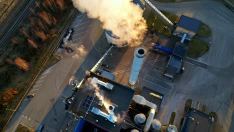 Aerial-top-down-shot-over-a-steam-coming-out-of-pipes-in-a-thermal-power-plant