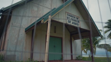 An-abandoned-and-weathered-beachside-Church-on-a-gloomy-day,-showing-the-front-entrance