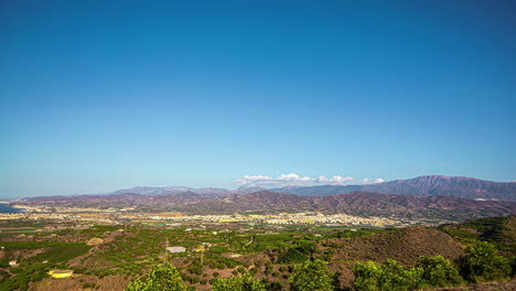 Sunny-panoramic-timelapse-of-Malaga's-landscape-with-mountains-and-clear-blue-sky