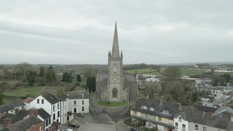 Clones-town-with-historic-church,-county-monaghan,-ireland,-overcast-day,-aerial-view