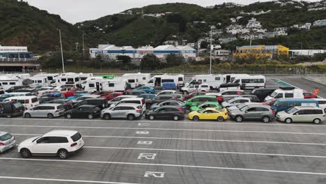 Drone-view-of-Vehicles-waiting-in-line-for-the-ferry-in-Wellington,-New-Zealand