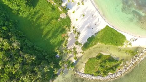 Overhead-drone-shot-panning-above-beachfront-of-Miami-Resort,-a-perfect-getaway-located-in-Central-Greece,-facing-the-Ionian-Sea