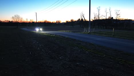 Tesla-driving-in-rural-USA-during-sunset