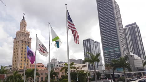 Freedom-Tower-at-Miami-Dade-College,-Flags-in-Front-of-American-Airlines-Arena