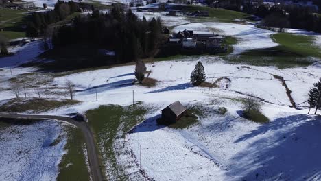 Drone-shot-of-little-mountain-village-in-Austria-in-late-winter