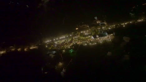Aerial-drone-view-of-people-celebrating-in-a-big-place-and-also-showing-a-big-party-plot-where-cool-firecrackers-are-bursting
