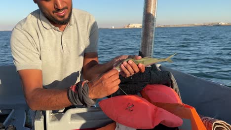 teach-how-to-fishing-in-the-sea-the-fisherman-on-boat-have-marine-sea-adventure-experience-for-traveler-tourist-attraction-seaside-fishing-tour-in-gulf-the-arabian-culture-traditional-skill-methods