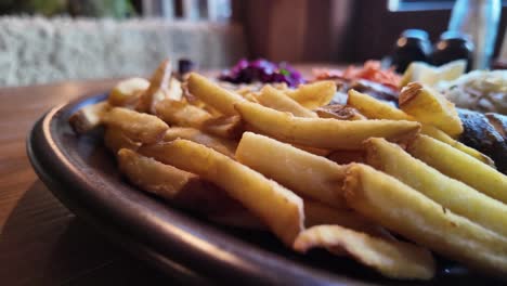 Fries-On-Brown-Plate-In-Restaurant