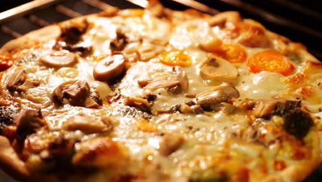 Close-up-of-frozen-pizza-getting-cooked-in-oven