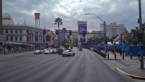POV,-Driving-on-Las-Vegas-Strip-on-Cloudy-Day,-Traffic-and-Pedestrians-on-Crosswalk,-Nevada-USA