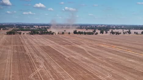 Dust-trails-over-freshly-harvested-fields-in-the-rural-Yarrawonga-landscape-in-Victoria-Australia