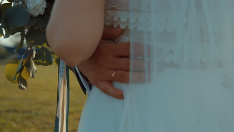 Wedding-ceremony-outdrro-bride-and-groom-with-flowers