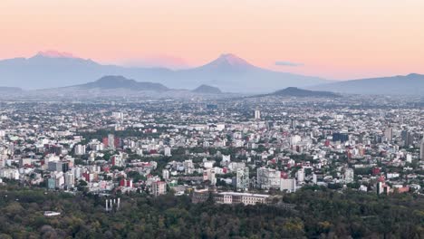 Drone-shot-of-bosque-de-Chapultepec-and-volcanoes-at-mexico-city