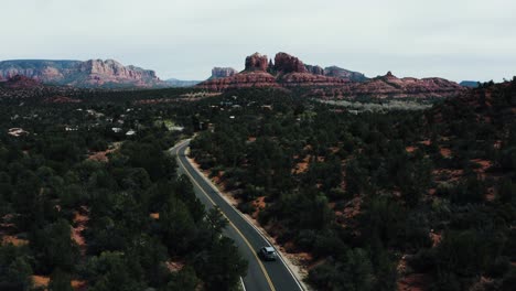 Car-driving-through-Arizona's-rural-desert