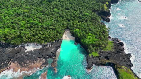 Bird's-eyes-on-Bateria-beach,one-of-the-most-amazing-beaches-from-world,located-at-Ilheu-das-Rolas-in-Sao-Tome,Africa