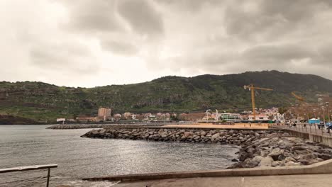 Push-in-shot-of-Machico-bay-on-a-cloudy-morning,-Slow-motion-Madeira-Island