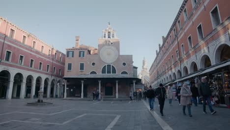 Morning-bustle-in-the-shadow-of-Venice's-old-clock-tower