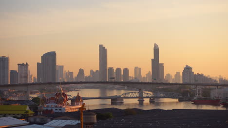 People-are-going-to-work-early-in-the-morning,-against-the-background-of-Bangkok's-business-district