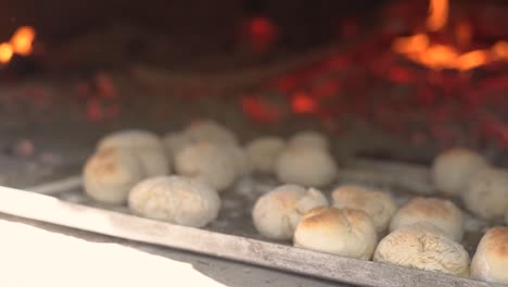 Cooking-bread-in-clay-oven-traditional-bakery-of-pastry-in-slow-motion