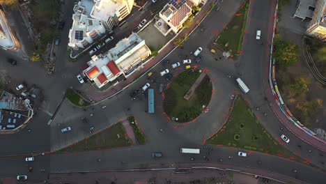 Aerial-drone-view-in-drone-camera-In-drone-camera-many-vehicles-are-passing-through-government-where-many-four-wheels-and-bikes-are-visible