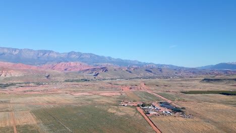 Scenic-Nature-Landscape-With-Fields-And-Mountains-In-Hurricane-City,-Utah---Drone-Shot