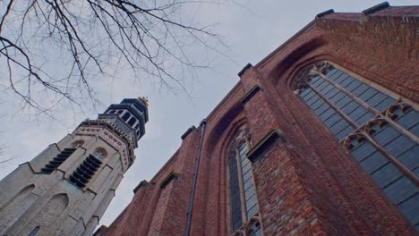 Traditional-European-Dutch-style-cathedral-chapel-tower-architecture-building-in-Netherlands-with-authentic-art-design-and-sightseeing-walkthrough-and-low-angle-viewpoint