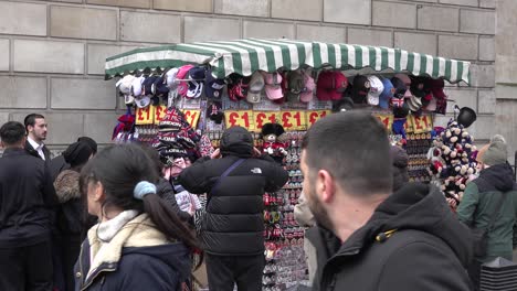 Israeli-tourists-buy-gifts-from-a-stall-on-Whitehall-Street-in-London,-UK