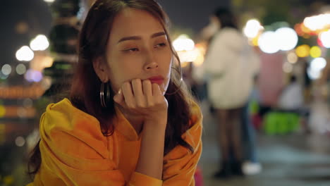 Young-Vietnamese-woman-staring-gawking-at-the-side-of-the-street