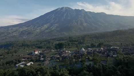 Reveal-drone-shot-of-Stabelan-Village-with-Merbabu-Mountain-on-the-background