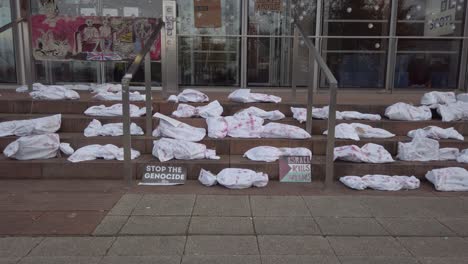 Wide-shot-of-mock-dead-bodies-outside-the-Scotland-BBC-Headquarters