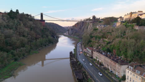 Aerial-dolly-over-River-Avon-toward-Clifton-suspension-bridge,-Hotwells,-Bristol