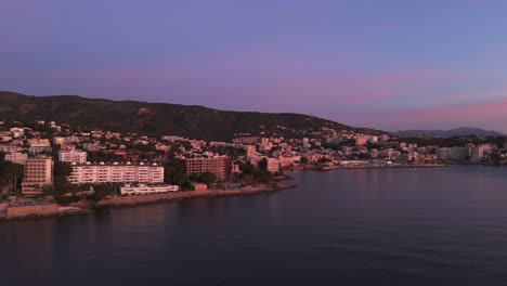 Pink-Sunset-Light-Across-Resort-Apartment-Buildings-In-Palma,-Majorca