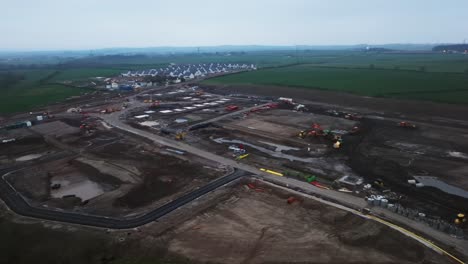 Slow-panning-shot-of-a-construction-site-developing-building-houses-in-Scotland