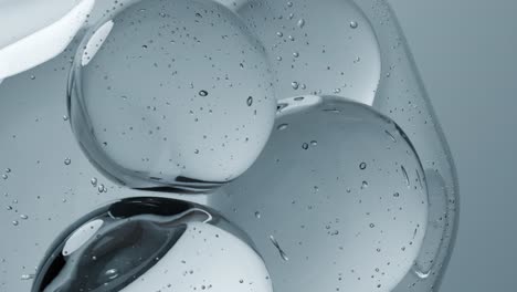Macro-view-of-3D-water-bubbles-on-a-gray-background