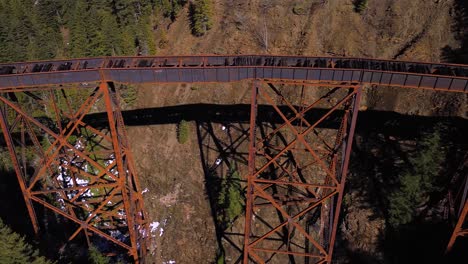 Aerial-Drone-Shot-Panning-Across-Ladner-Creek-Trestle-Railway-Bridge-in-British-Columbia,-Canada