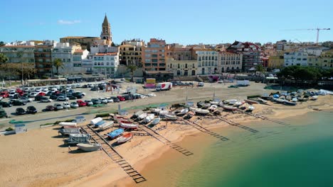 Palamós'-aerial-imagery-showcases-its-iconic-fishing-boats-dotting-the-coastline,-depicting-a-timeless-maritime-tradition