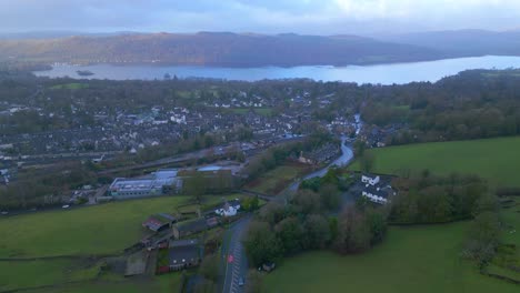 Panoramic-drone-shot-of-Windermere,-a-village-that-is-a-part-of-the-Lake-District-National-Park,-located-in-Cumbria,-Northwest-of-England-in-United-Kingdom