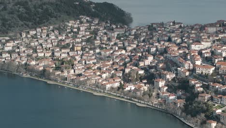 A-close-up-drone-shot-of-village-island,-warm-weather,-flying-above-a-dreamy-clear-water-lake,-4K-video,-European-winter-nature,-beautiful-landscape