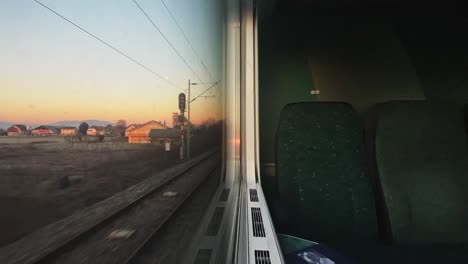 Time-lapse-train-window-view-on-sunrise-Croatia,-Slovenia