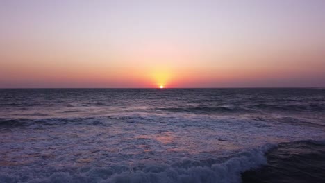 Sea-landscape-sunset-over-horizon-twilight-evening-blue-pink-sky-wonderful-marine-scenic-wide-view-landscape-of-water-adventure-aerial-drone-shot-travel-to-coastal-beach-panoramic-view-in-Iran-nature