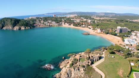 Aerial-shots-of-La-Fosca-capture-the-grandeur-of-the-castle's-fortified-walls-and-towering-turrets,-evoking-a-sense-of-awe-and-wonder-among-luxury-travelers