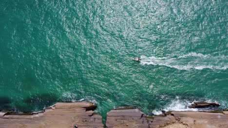 Boat-tour-in-rock-cliff-sea-side-beach-the-aerial-birds-eye-Iran-landscape-view-of-scenic-panoramic-summer-leisure-Qatar-travel-Saudi-tourism-destination-the-coastal-honeymoon-Arabian-resort-landscape