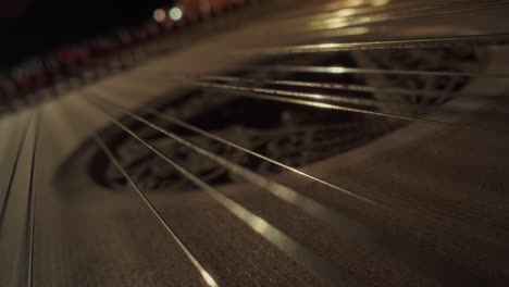 grand-piano-strings,-no-camera-movement,-closeup,-slow-motion,-dark,-yellow-wood