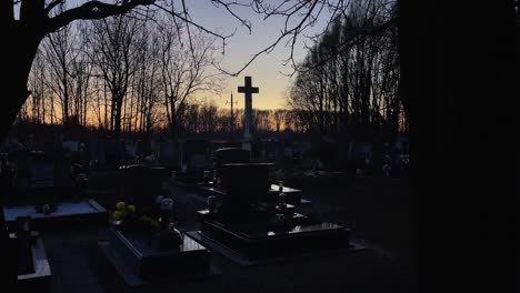 Graveyard-Christian-in-evening-with-cross-wide,-Mosonmagyarovar,-Hungary