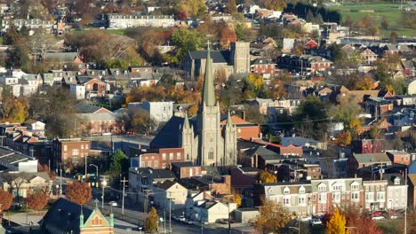 Chapel-of-historic-church-among-row-houses-in-urban-USA-city-during-autumn