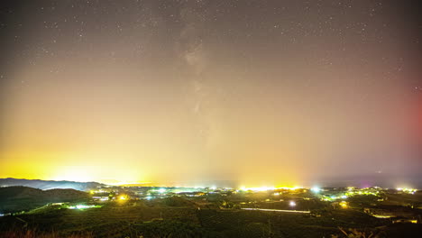 Stargazing-towards-Milky-Way,-sky-full-of-stars-on-nighttime,-city-of-Malaga-surrounded-by-vineyards