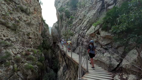 Woman-walking-on-wooden-path-deck-Observation-Towers-in-Tarifa-Spain