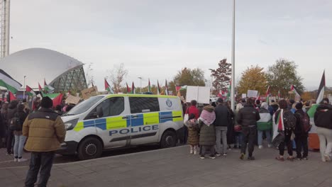 Protesters-near-a-police-van-at-a-march-in-Glasgow