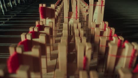 grand-piano-mallets,-camera-moves-backwards,-very-closeup,-dark,-yellow-wood